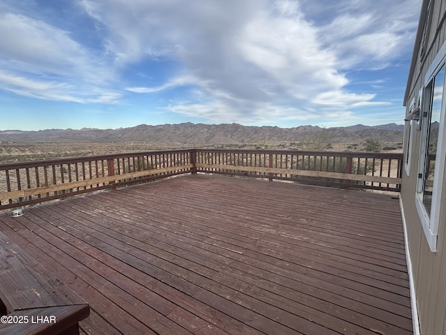 wooden deck featuring a mountain view