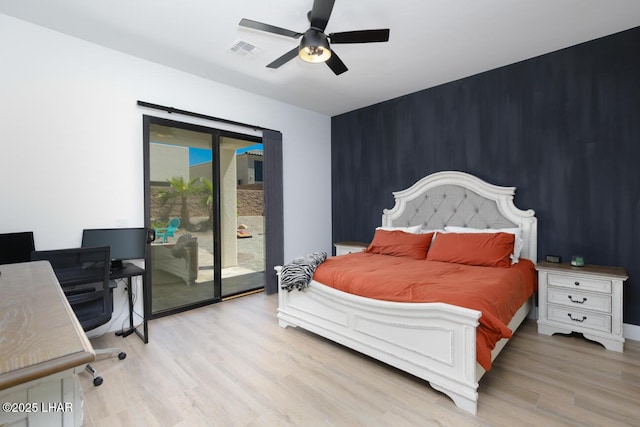 bedroom with visible vents, access to outside, a ceiling fan, and wood finished floors