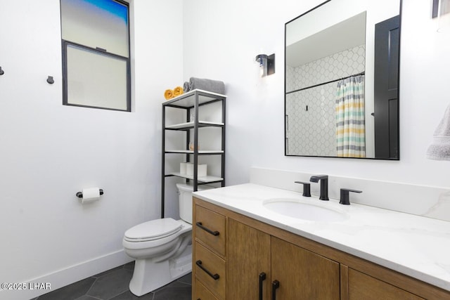 bathroom featuring vanity, toilet, a shower with shower curtain, tile patterned floors, and baseboards