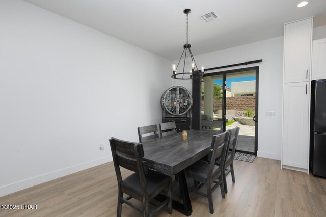 dining room with an inviting chandelier, visible vents, recessed lighting, light wood finished floors, and baseboards
