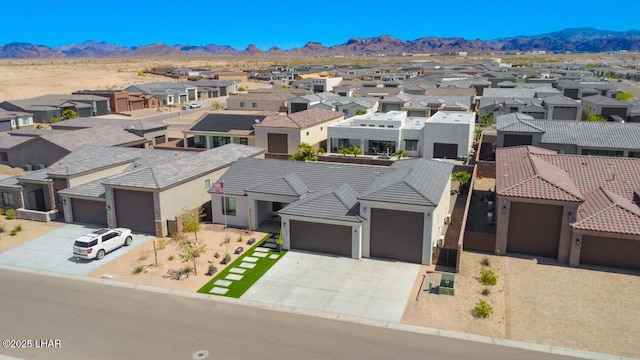 aerial view featuring a mountain view and a residential view