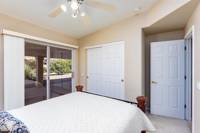 bedroom featuring lofted ceiling, a closet, light colored carpet, a ceiling fan, and access to outside