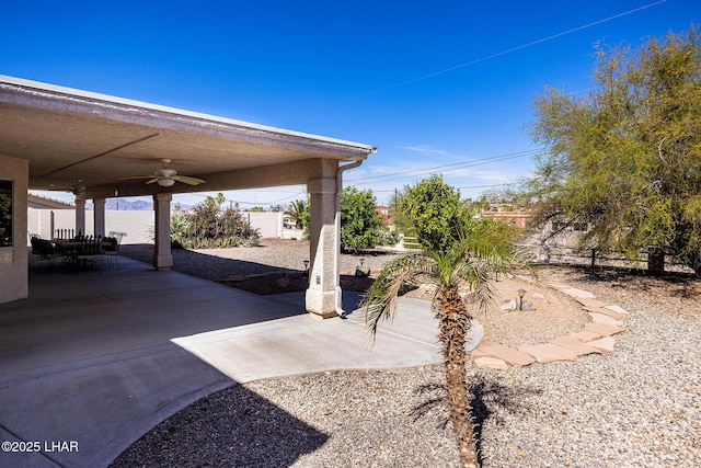 view of patio / terrace featuring a ceiling fan and fence