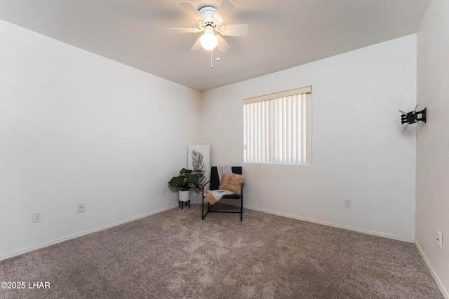 unfurnished room with baseboards, a ceiling fan, and carpet