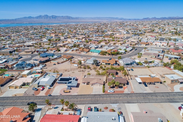 birds eye view of property featuring a mountain view and a residential view