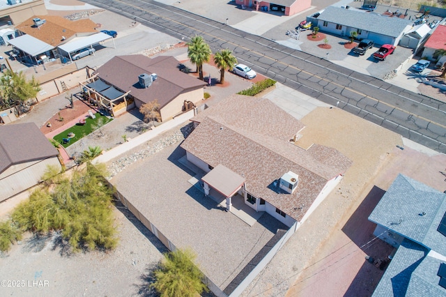 birds eye view of property with a residential view