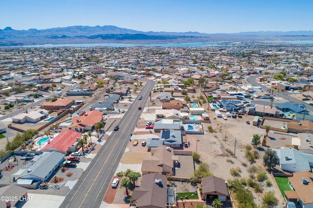 birds eye view of property featuring a mountain view and a residential view