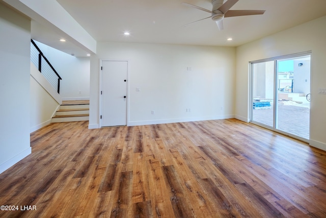 spare room featuring ceiling fan and light hardwood / wood-style floors