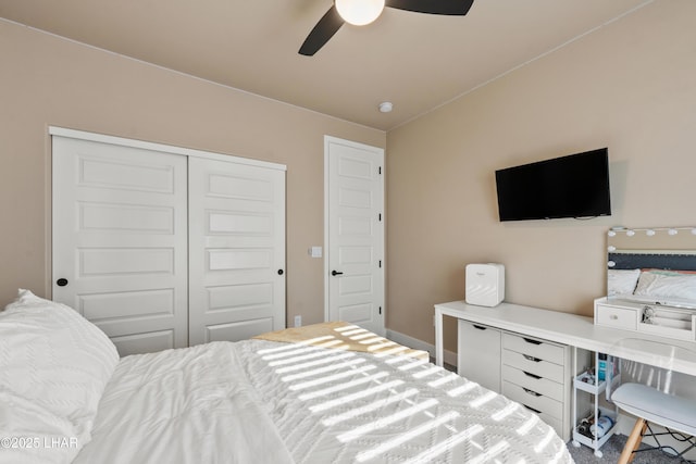 bedroom featuring ceiling fan and a closet