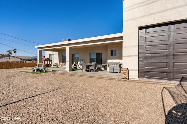 rear view of house featuring a patio area