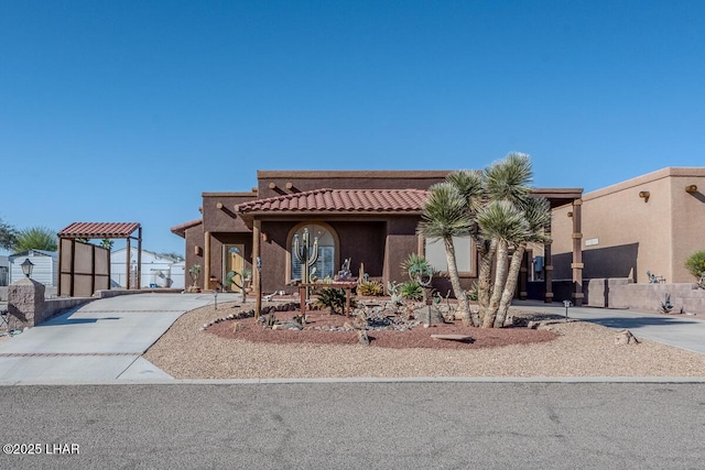 1972 E Bayshore Rd, Lake Havasu City, AZ 86404 - view of front of home featuring a tiled roof, stucco siding, and driveway