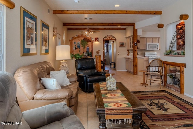 1972 E Bayshore Rd, Lake Havasu City, AZ 86404 - living area featuring visible vents, beamed ceiling, light tile patterned floors, baseboards, and ceiling fan