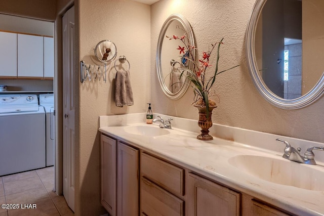 1972 E Bayshore Rd, Lake Havasu City, AZ 86404 - full bath featuring washing machine and clothes dryer, tile patterned flooring, a textured wall, and a sink