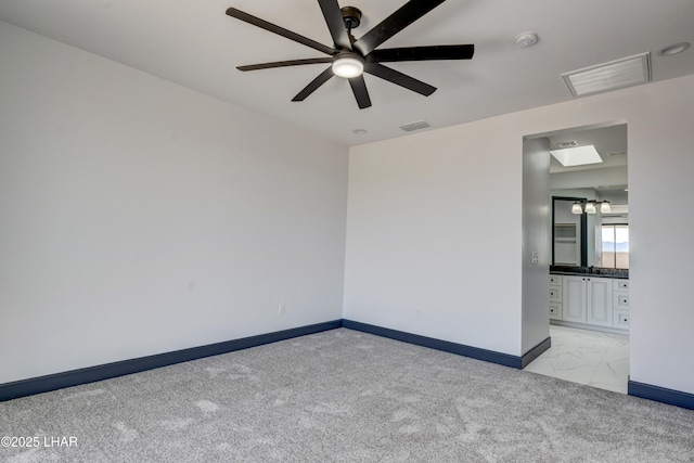 unfurnished room with light colored carpet, visible vents, and baseboards