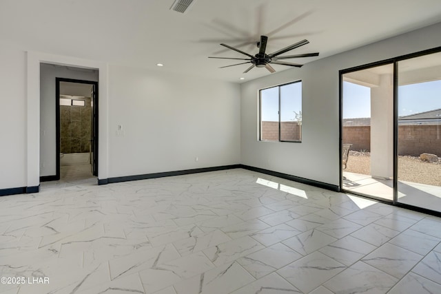 empty room with marble finish floor, recessed lighting, visible vents, and baseboards