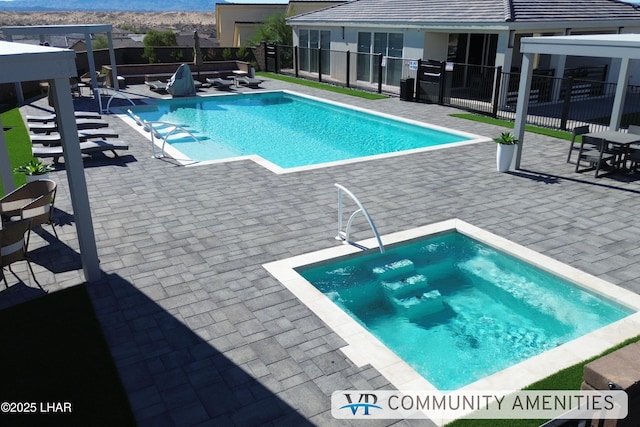 pool with a patio and fence