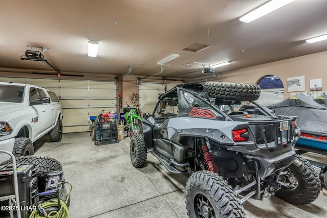 garage featuring a garage door opener