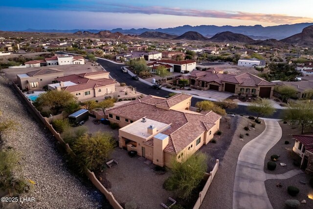 aerial view at dusk with a mountain view