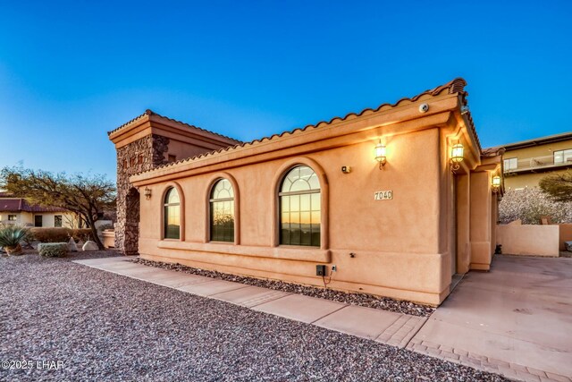 view of property exterior at dusk