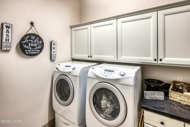 laundry room with cabinets and washing machine and dryer