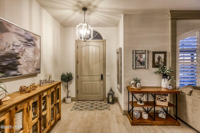 entryway featuring a notable chandelier and light wood-type flooring