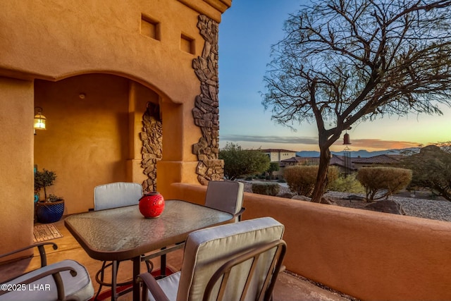 view of patio terrace at dusk