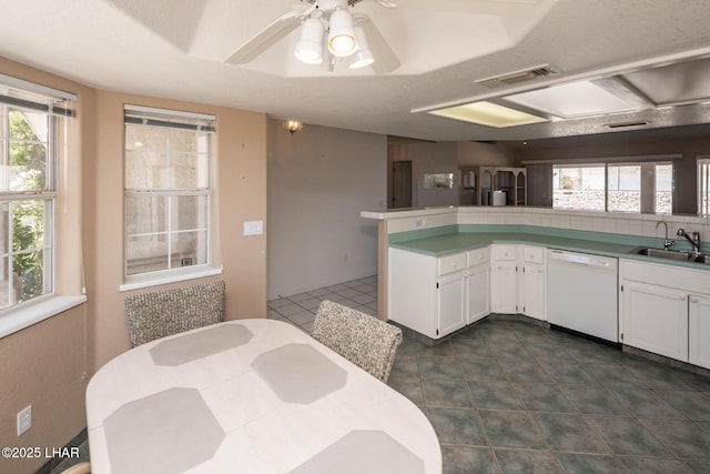 4080 Albacore Dr, Lake Havasu City, AZ 86406 - kitchen with white dishwasher, a sink, white cabinetry, and ceiling fan