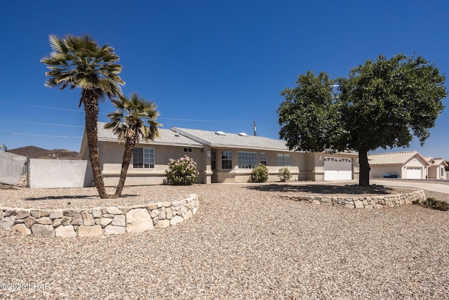 4080 Albacore Dr, Lake Havasu City, AZ 86406 - view of front of property with an attached garage, stucco siding, and driveway