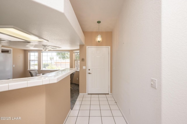 4080 Albacore Dr, Lake Havasu City, AZ 86406 - entryway featuring light tile patterned floors and ceiling fan