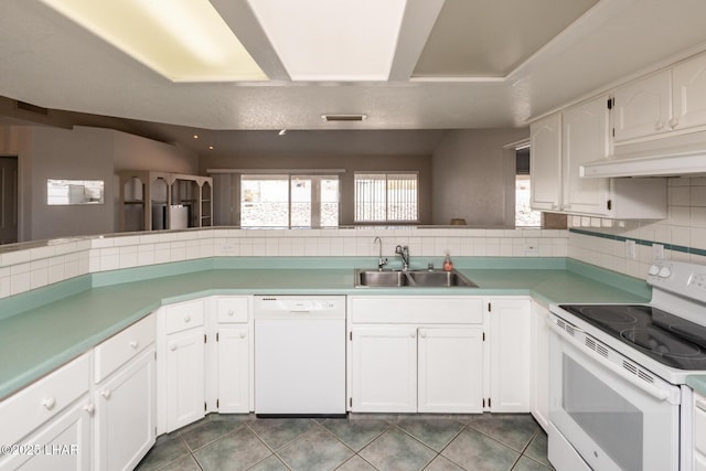 4080 Albacore Dr, Lake Havasu City, AZ 86406 - kitchen featuring white appliances, a sink, under cabinet range hood, and white cabinets