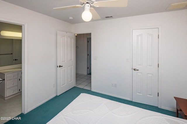 4080 Albacore Dr, Lake Havasu City, AZ 86406 - bedroom with baseboards, connected bathroom, and ceiling fan