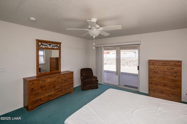 4080 Albacore Dr, Lake Havasu City, AZ 86406 - carpeted bedroom featuring access to outside, a textured ceiling, and a ceiling fan
