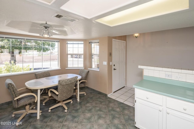 4080 Albacore Dr, Lake Havasu City, AZ 86406 - dining room with dark tile patterned flooring and a ceiling fan