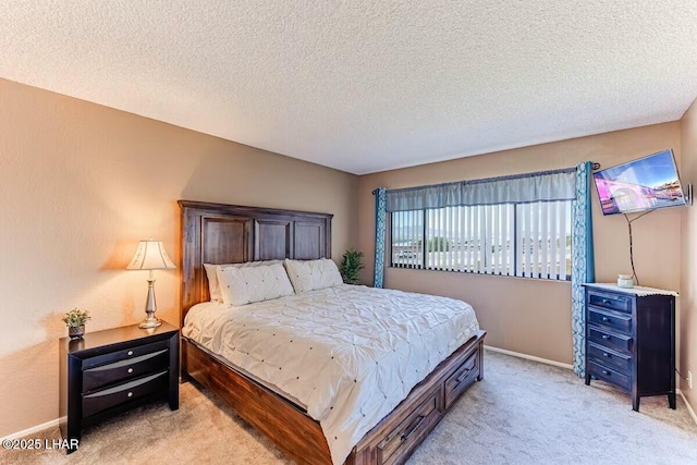 carpeted bedroom featuring a textured ceiling