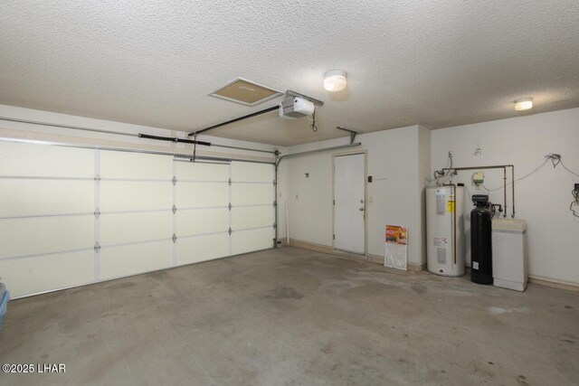 garage with a garage door opener and water heater