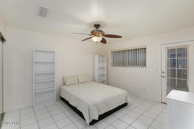 bedroom featuring ceiling fan and light tile patterned floors