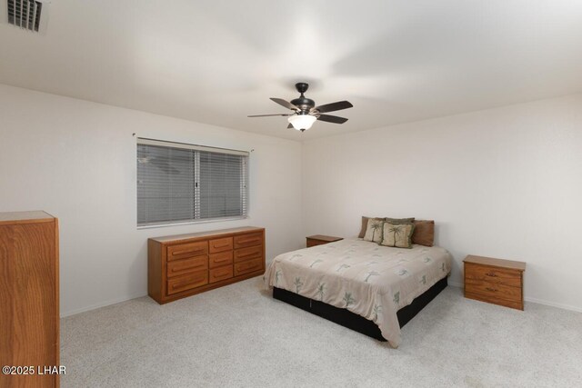 bedroom with light carpet and ceiling fan