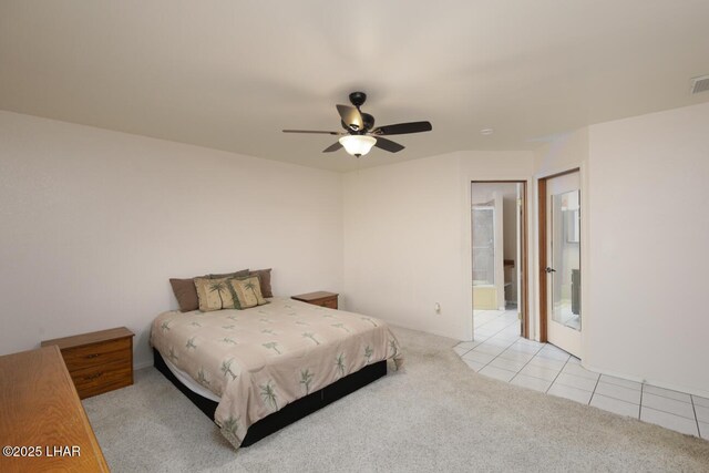 bedroom featuring light colored carpet and ceiling fan