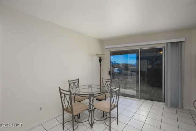 dining room with light tile patterned flooring