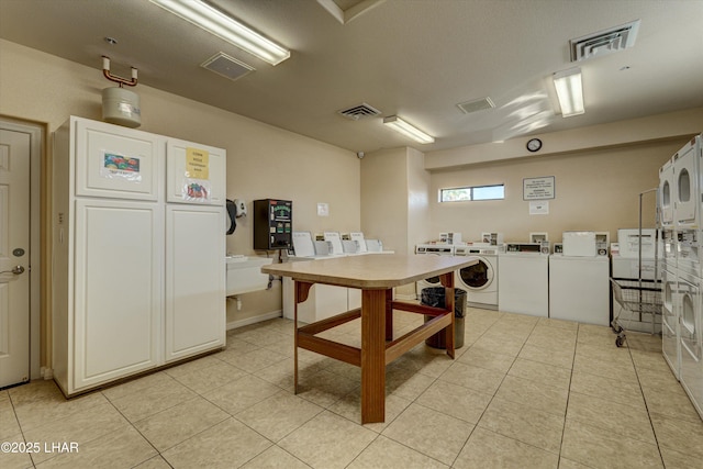 interior space featuring visible vents and washer and clothes dryer