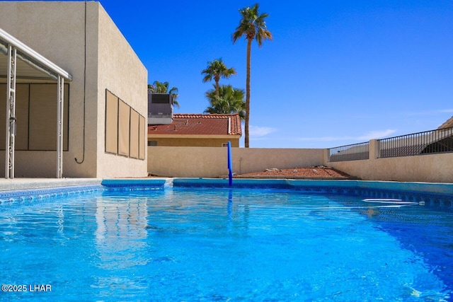 view of pool featuring a fenced in pool and fence