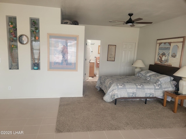 tiled bedroom featuring carpet and connected bathroom