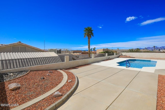 view of swimming pool featuring a patio, a fenced backyard, and a fenced in pool