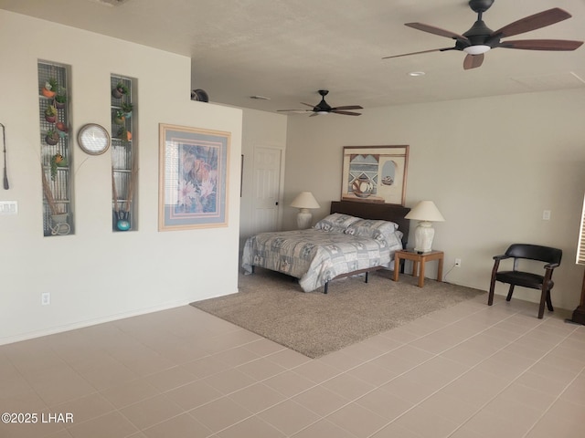 bedroom featuring light carpet and ceiling fan