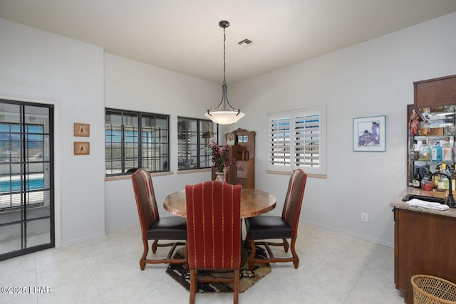 dining area featuring visible vents and baseboards