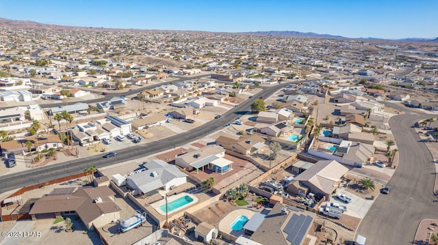 birds eye view of property with a mountain view