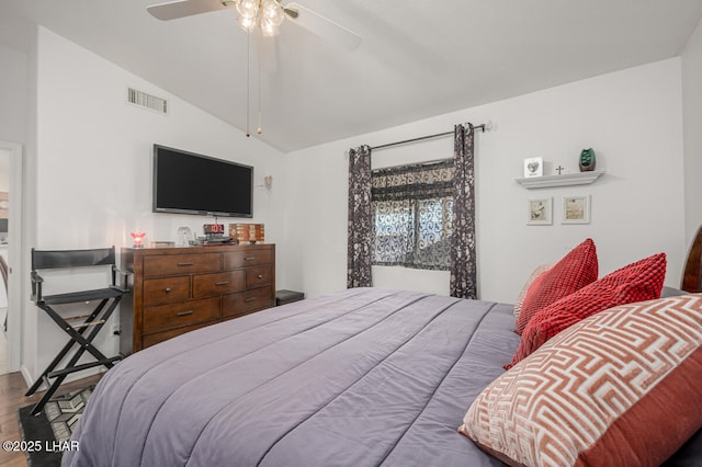 bedroom featuring lofted ceiling, wood-type flooring, and ceiling fan