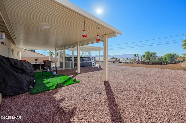 view of yard with a mountain view and a patio area