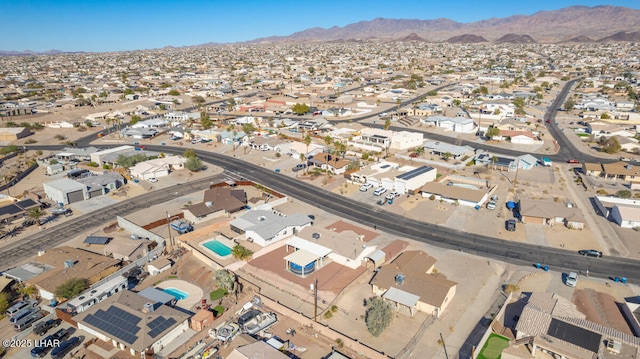 birds eye view of property featuring a mountain view