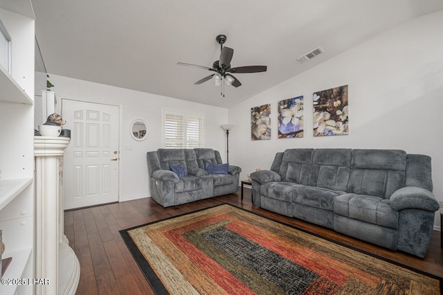 living room featuring ceiling fan, lofted ceiling, and dark hardwood / wood-style flooring